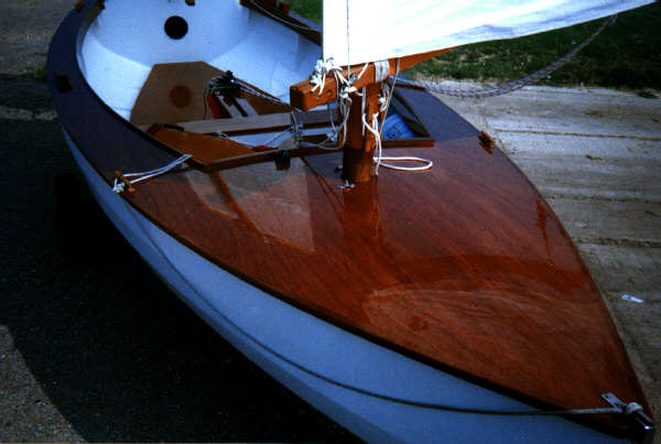 Mizzen mast and sail reflected in the foredeck